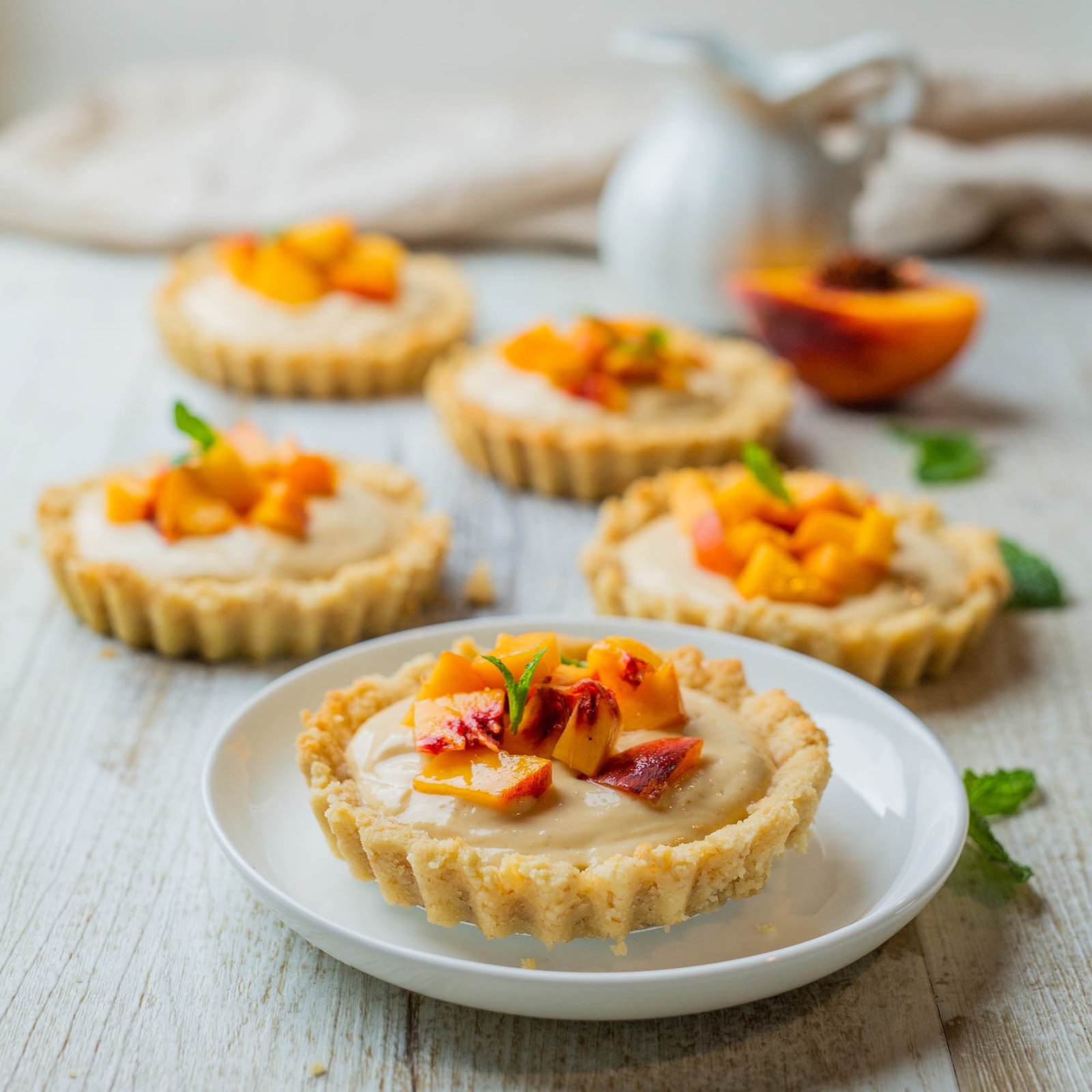 Vegan mini peach custard tarts